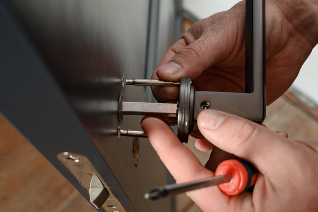 Worker installing new lock